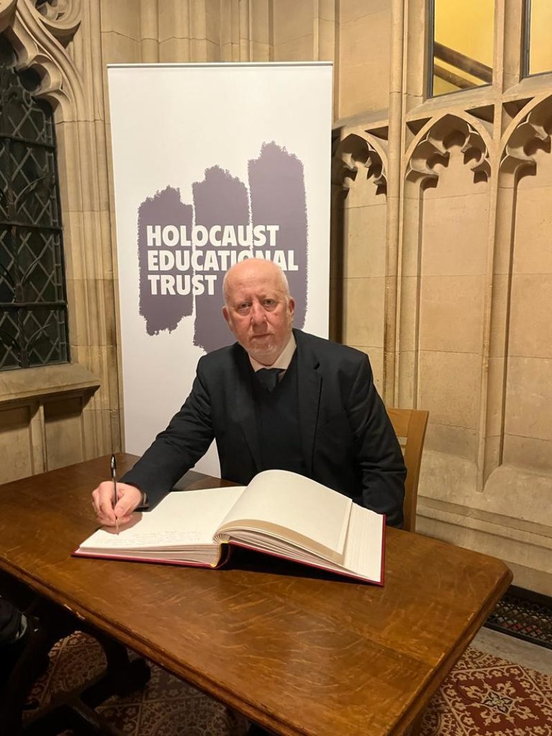 Andy McDonald signing the Holocaust Commitment Pledge