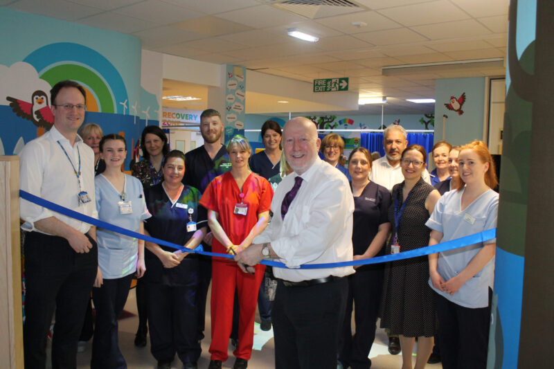 Andy cutting the ribbon at the new children